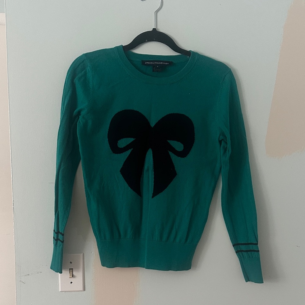 Blue sweater with Black Bow Design